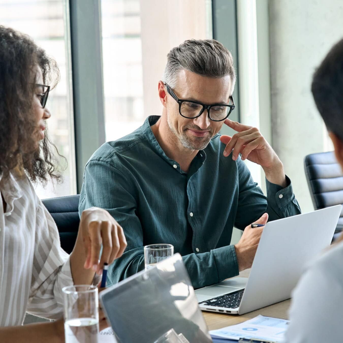 icf-credentialing-resources-for-credential-application A group of professional review the ICF Resources for credential applications.